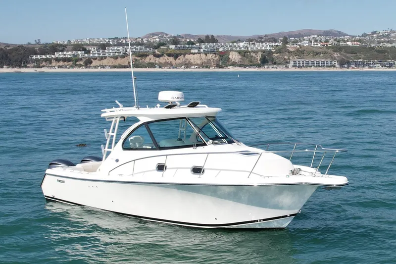 Slide: The Image of 2011 Pursuit 315 Offshore boat on calm ocean near scenic coastline. - 7