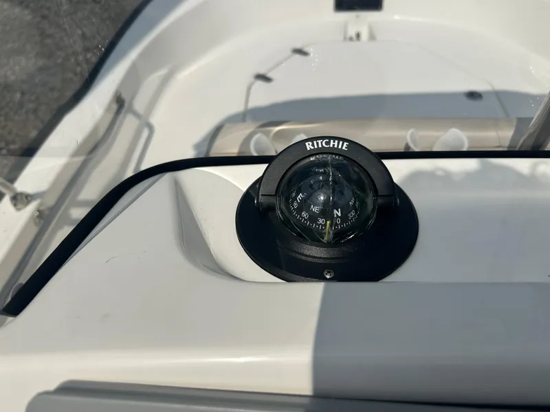 Slide: The Image of Compass on 2018 Boston Whaler 150 Montauk boat dashboard, Ritchie brand. - 18