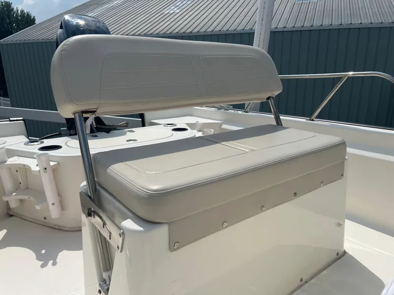 Slide: The Image of 2018 Boston Whaler 150 Montauk boat seat with storage, featuring sleek design and durable materials. - 21