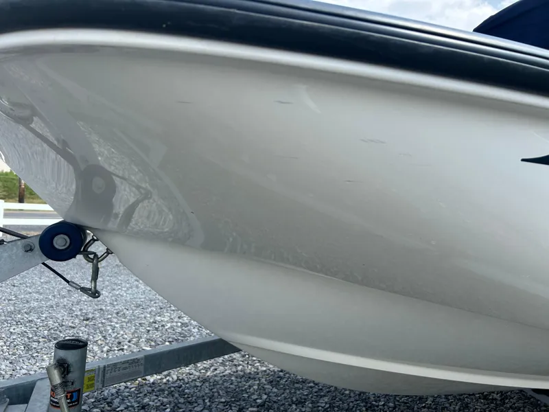 Slide: The Image of 2018 Boston Whaler 150 Montauk boat hull on trailer, close-up view. - 4
