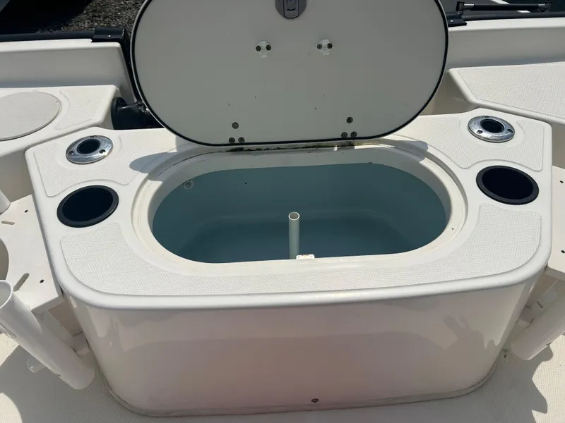 Slide: The Image of Open storage compartment on a 2018 Boston Whaler 150 Montauk boat. - 9