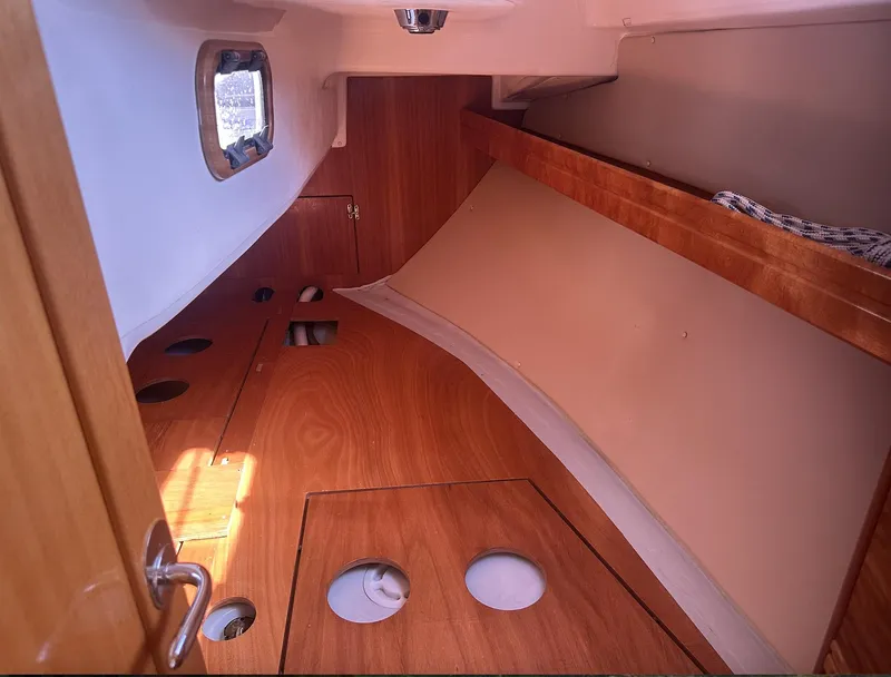 Slide: The Image of Interior cabin of 2007 Bavaria 30 Cruiser sailboat with wooden finish. - 12
