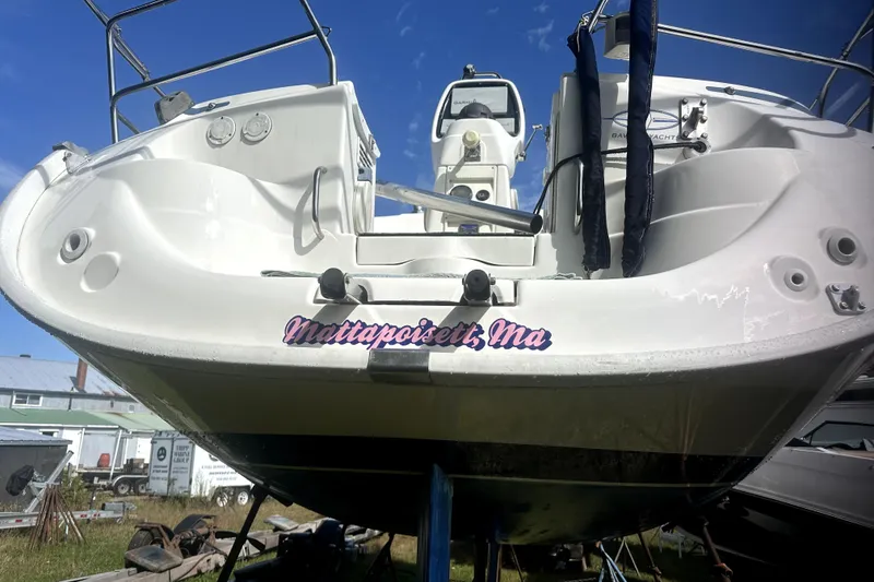 Slide: The Image of 2007 Bavaria 30 Cruiser sailboat on land, Mattapoisett, MA, under clear blue sky. - 18