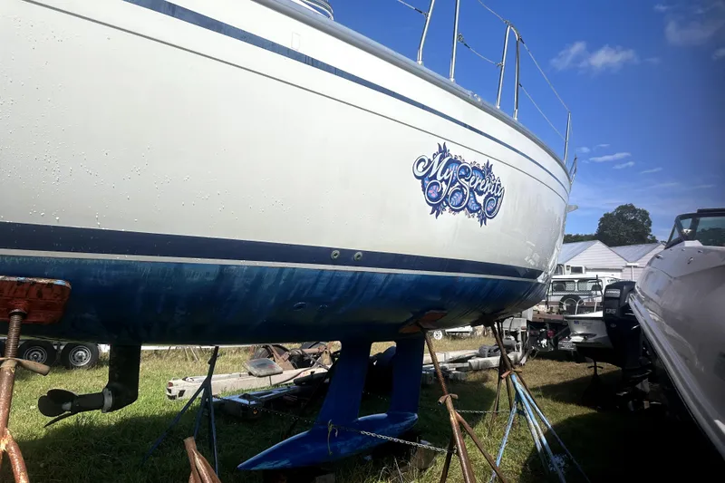 Slide: The Image of Bavaria 30 Cruiser 2007 sailboat "My Serenity" on stands, blue sky background. - 20