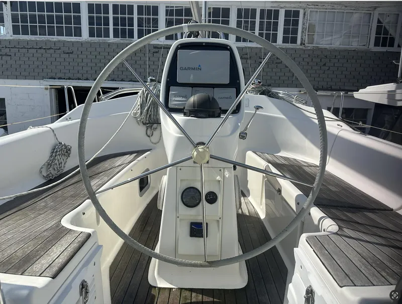 Slide: The Image of Steering wheel of 2007 Bavaria 30 Cruiser sailboat with Garmin navigation system. - 4