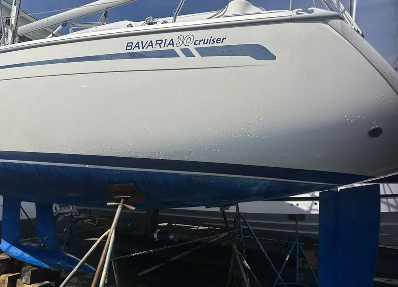 Slide: The Image of Bavaria 30 Cruiser 2007 sailboat on stands, hull view, in dry dock. - 8