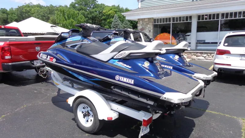 Slide: The Image of 2015 Yamaha WaveRunner VX Cruiser on trailer, parked outdoors. - 2