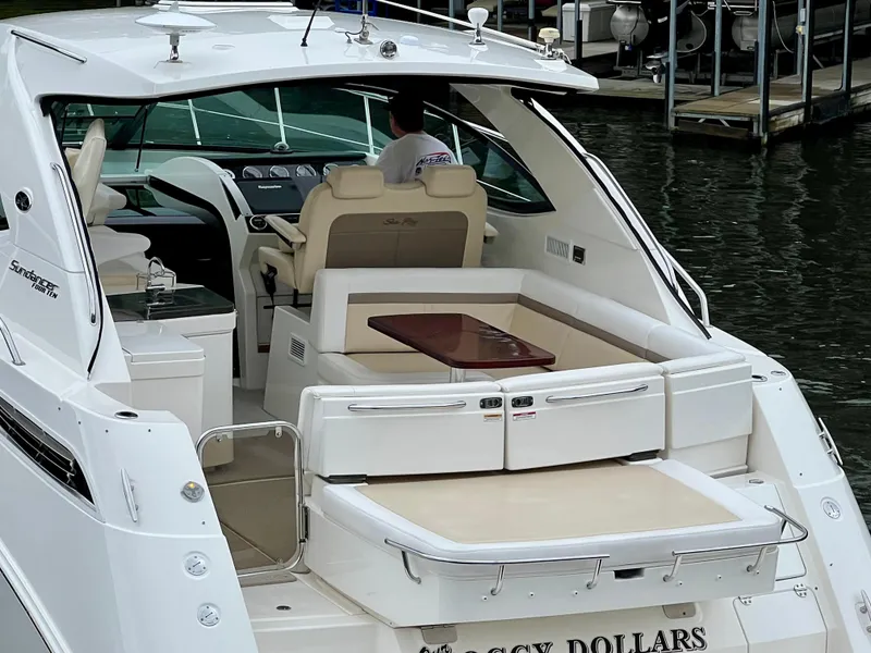 Slide: The Image of 2014 Sea Ray 410 Sundancer yacht with spacious seating and elegant interior design. - 10