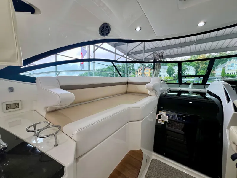 Slide: The Image of 2014 Sea Ray 410 Sundancer interior with plush seating and modern design. - 21