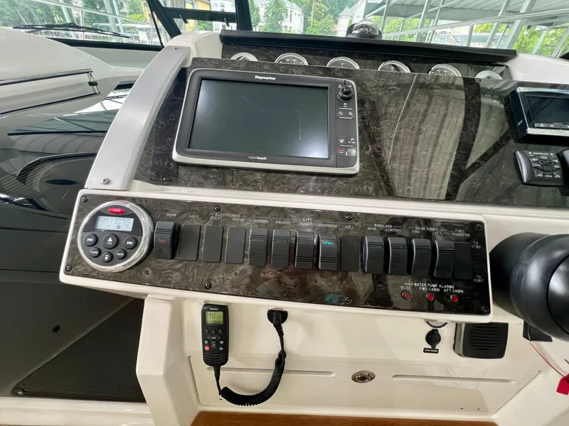 Slide: The Image of Control panel of a 2014 Sea Ray 410 Sundancer boat with navigation equipment. - 30