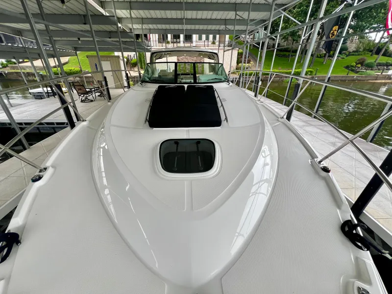 Slide: The Image of 2014 Sea Ray 410 Sundancer yacht docked under covered marina. - 34