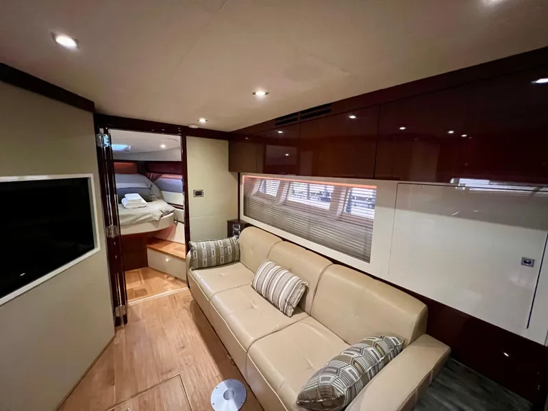 Slide: The Image of Luxurious interior of 2014 Sea Ray 410 Sundancer yacht with beige sofa and modern decor. - 39