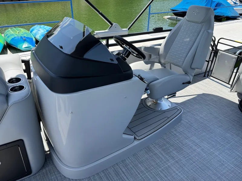 Slide: The Image of 2026 JC Neptoon Sport 23TT boat helm with modern seating and controls. - 15