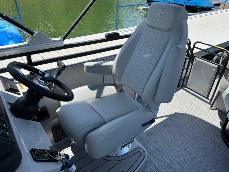 Slide: The Image of Captain's chair on 2026 JC Neptoon Sport 23TT boat, featuring sleek design and comfortable seating. - 16