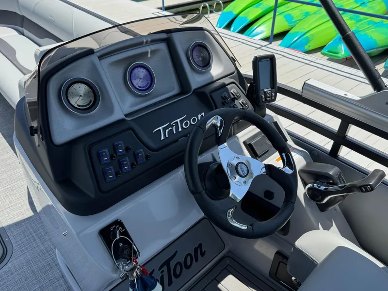 Slide: The Image of Steering console of 2026 JC Neptoon Sport 23TT boat with gauges and controls. - 18