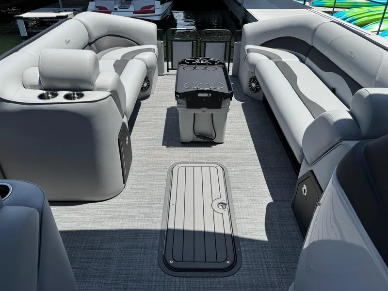 Slide: The Image of 2026 JC Neptoon Sport 23TT pontoon boat interior with gray seating and modern design. - 8