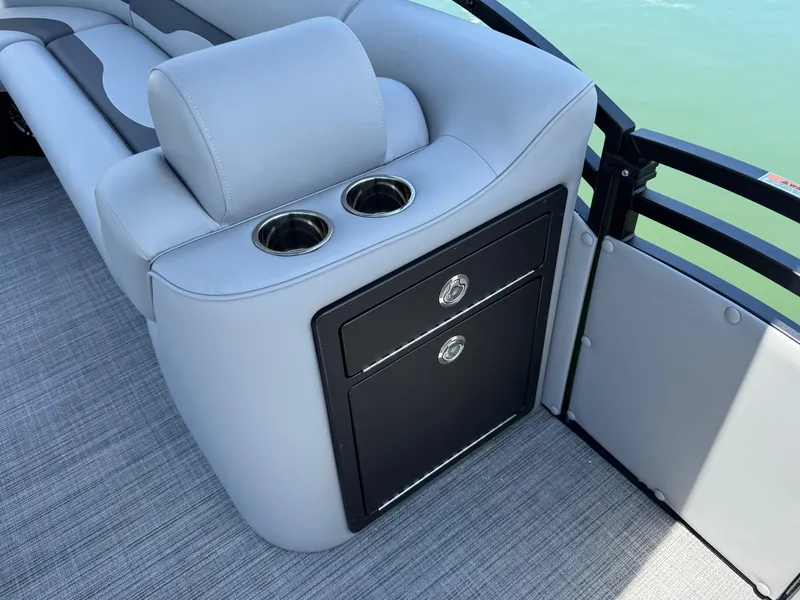 Slide: The Image of 2026 JC Neptoon Sport 23TT boat interior with cup holders and storage compartments. - 11