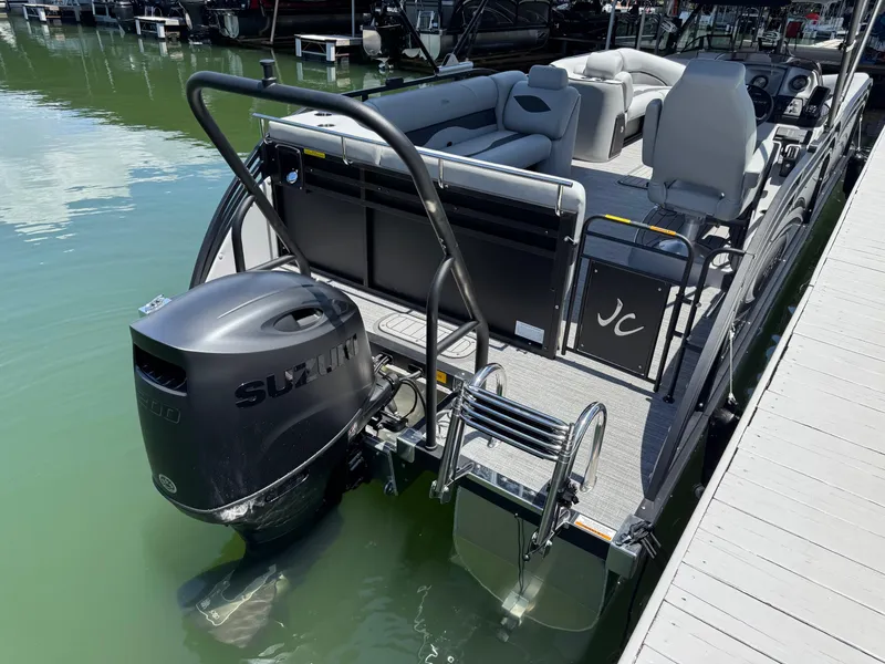 Slide: The Image of 2026 JC Neptoon Sport 23TT pontoon boat with Suzuki engine at dock. - 20