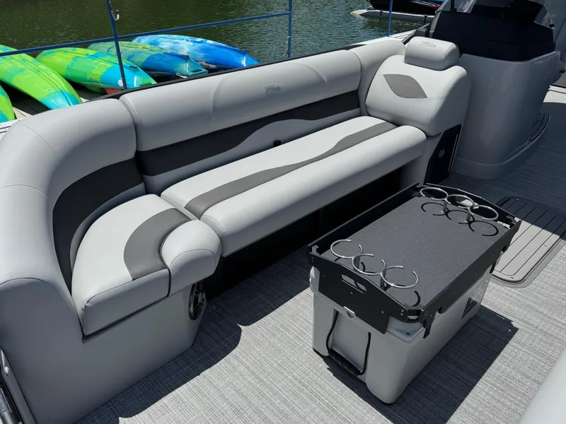 Slide: The Image of Luxurious seating on 2026 JC Neptoon Sport 23TT boat with cup holders and scenic view. - 5