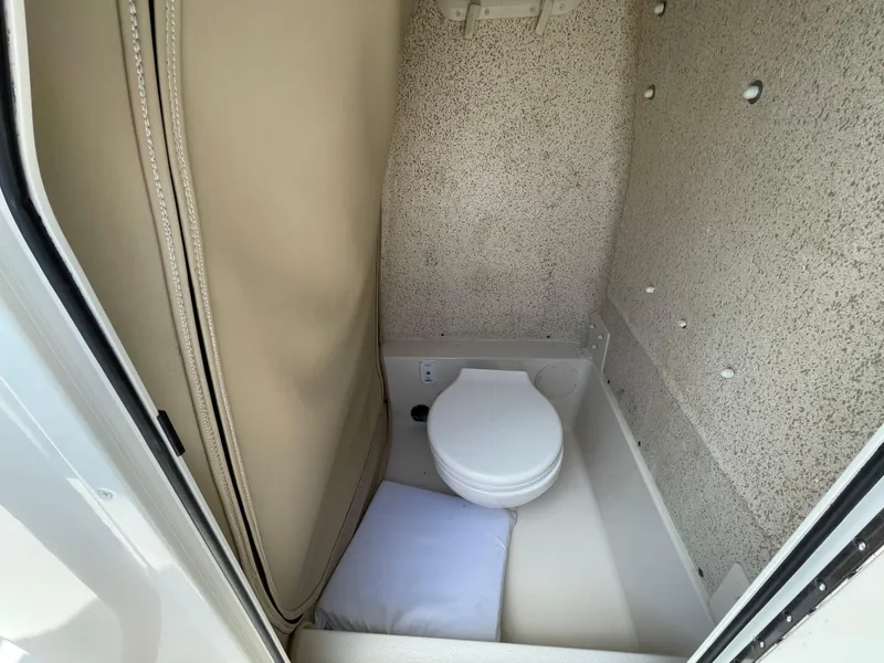 Slide: The Image of 2023 Sea Chaser 24 HFC boat interior with compact marine toilet. - 20