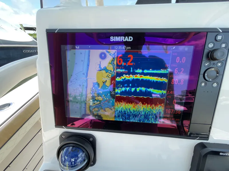 Slide: The Image of Simrad display on 2023 Sea Chaser 24 HFC showing navigation and sonar data. - 27