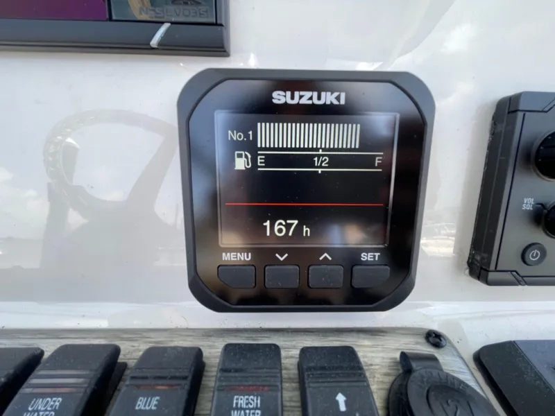 Slide: The Image of Suzuki fuel gauge display on 2023 Sea Chaser 24 HFC boat dashboard. - 28