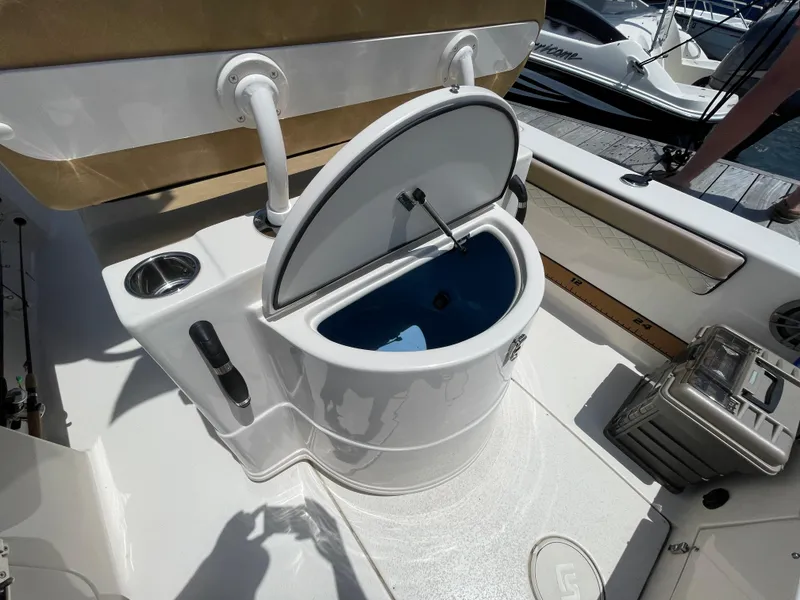 Slide: The Image of 2023 Sea Chaser 24 HFC boat with open livewell and fishing gear. - 40
