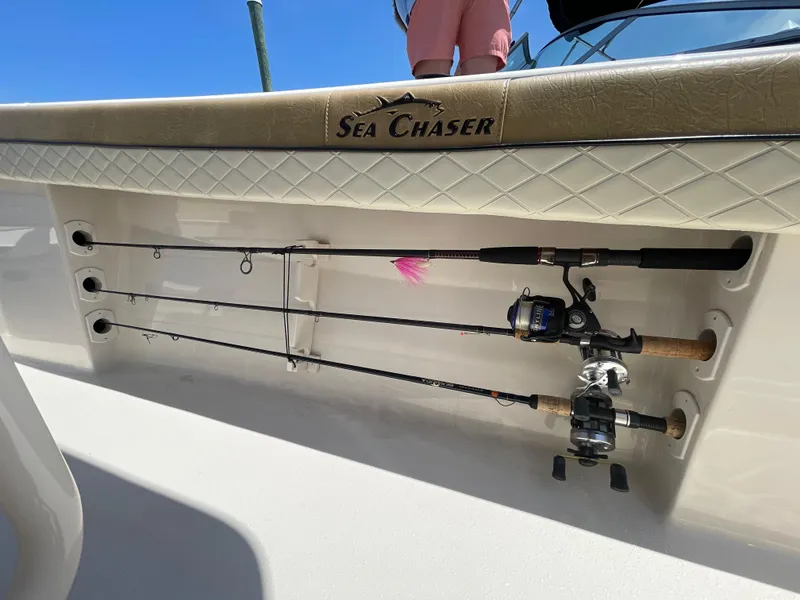 Slide: The Image of 2023 Sea Chaser 24 HFC boat with fishing rods stored on deck. - 46