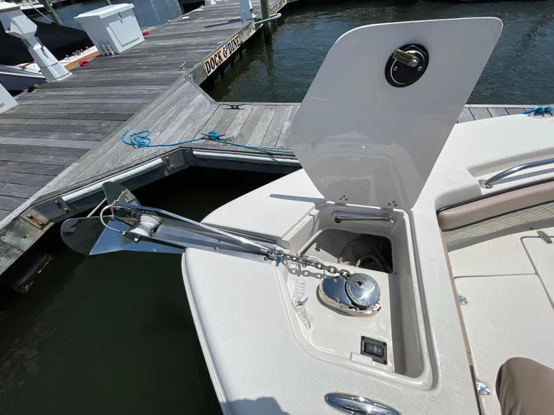 Slide: The Image of 2023 Sea Chaser 24 HFC boat anchor compartment at dockside. - 9