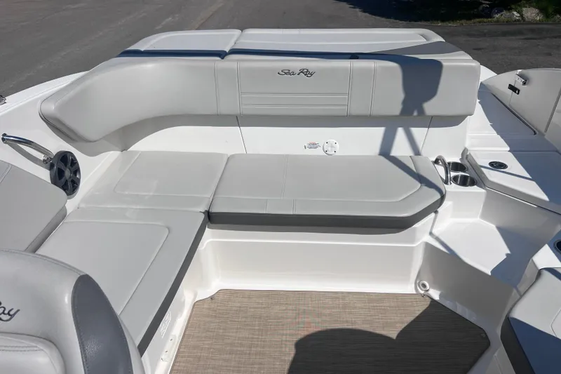 Slide: The Image of 2020 Sea Ray SPX 210 boat interior with gray seating and cup holders. - 12