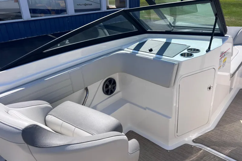 Slide: The Image of 2020 Sea Ray SPX 210 boat interior with sleek seating and modern dashboard design. - 13