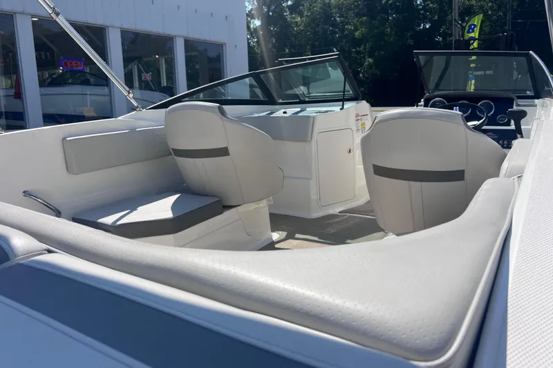 Slide: The Image of 2020 Sea Ray SPX 210 boat interior with seating and dashboard view. - 17