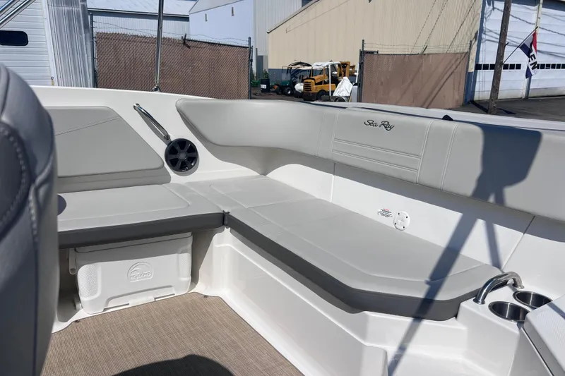 Slide: The Image of 2020 Sea Ray SPX 210 boat interior with gray seating and cup holders. - 21