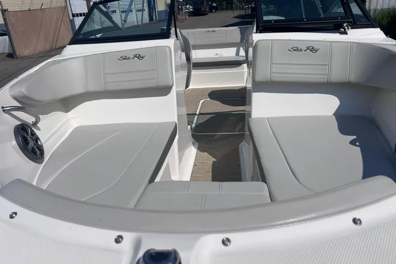 Slide: The Image of 2020 Sea Ray SPX 210 boat interior with gray seating and open deck layout. - 24