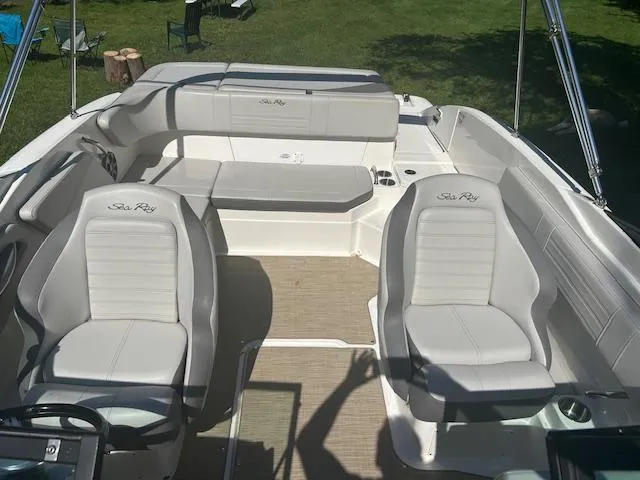 Slide: The Image of 2020 Sea Ray SPX 210 boat interior with white seating and spacious layout. - 7