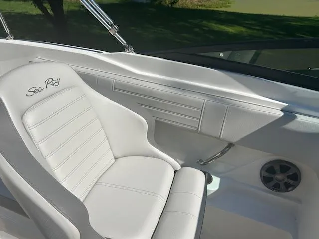 Slide: The Image of 2020 Sea Ray SPX 210 boat interior with white seating and sleek design. - 8