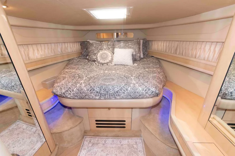 Slide: The Image of Luxurious cabin interior of 2001 Sea Ray 460 Sundancer yacht with elegant bedding. - 13