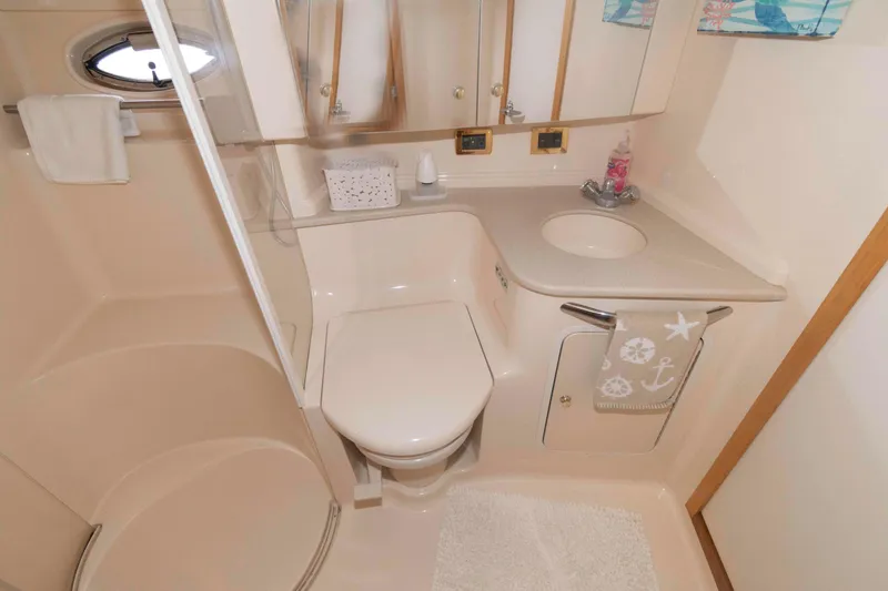 Slide: The Image of Luxurious bathroom in 2001 Sea Ray 460 Sundancer yacht with shower and vanity. - 14