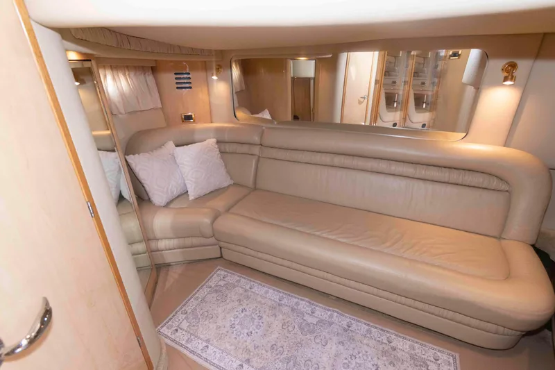 Slide: The Image of Luxurious interior of 2001 Sea Ray 460 Sundancer yacht with beige leather seating. - 15