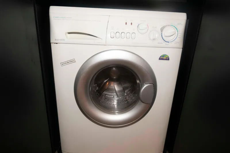 Slide: The Image of Front-loading washing machine in a compact space, featuring various control settings. - 16