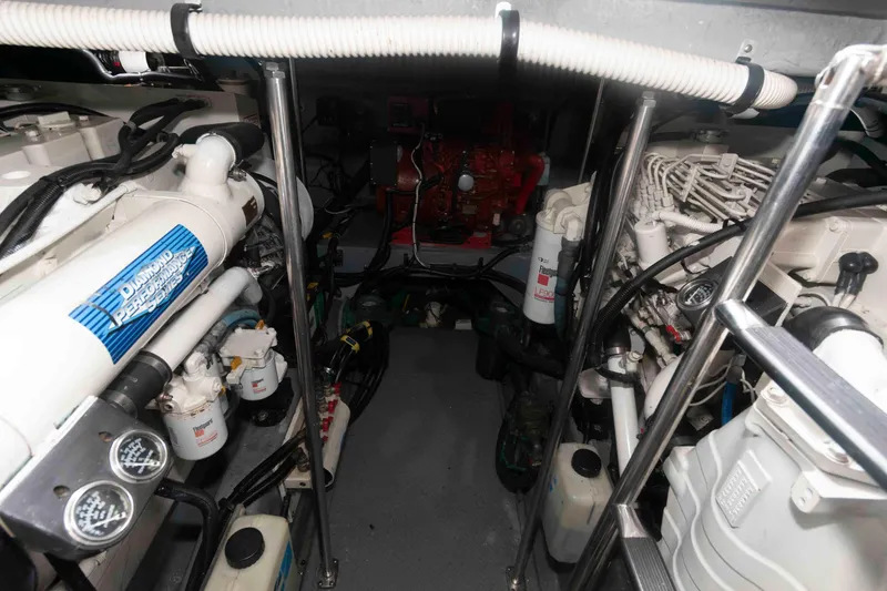 Slide: The Image of Engine room of a 2001 Sea Ray 460 Sundancer yacht, showcasing mechanical components. - 21