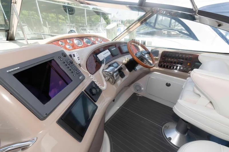Slide: The Image of Helm of 2001 Sea Ray 460 Sundancer yacht with navigation equipment and controls. - 7
