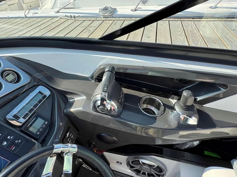 Slide: The Image of Control panel of 2017 Monterey 328 Super Sport boat with steering wheel and throttle. - 10