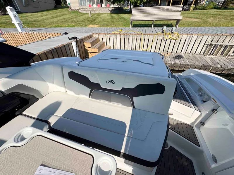 Slide: The Image of 2017 Monterey 328 Super Sport boat interior with seating and deck view. - 16