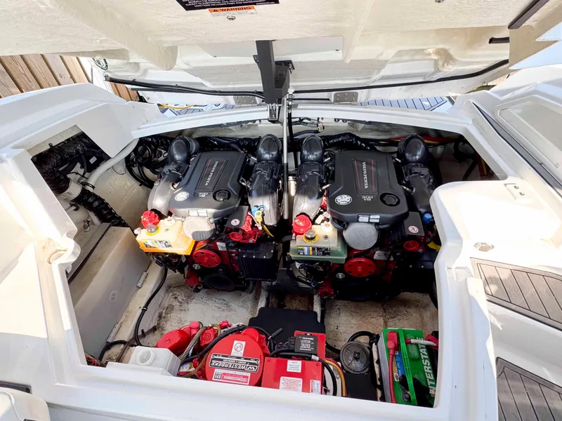 Slide: The Image of Engine compartment of a 2017 Monterey 328 Super Sport boat, featuring dual engines. - 19