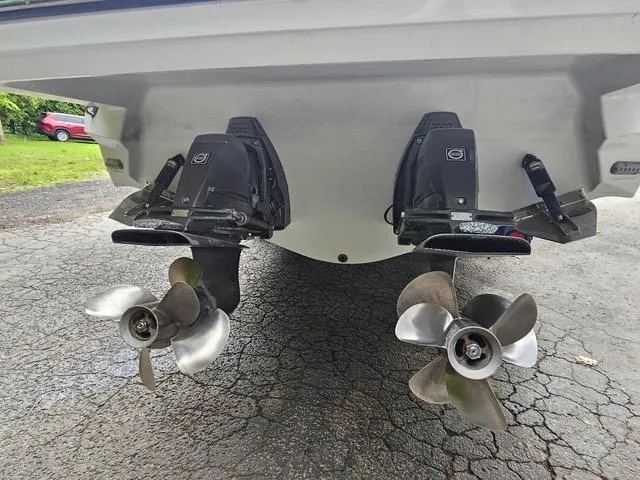 Slide: The Image of 2017 Monterey 328 Super Sport boat with dual propellers on a paved surface. - 22