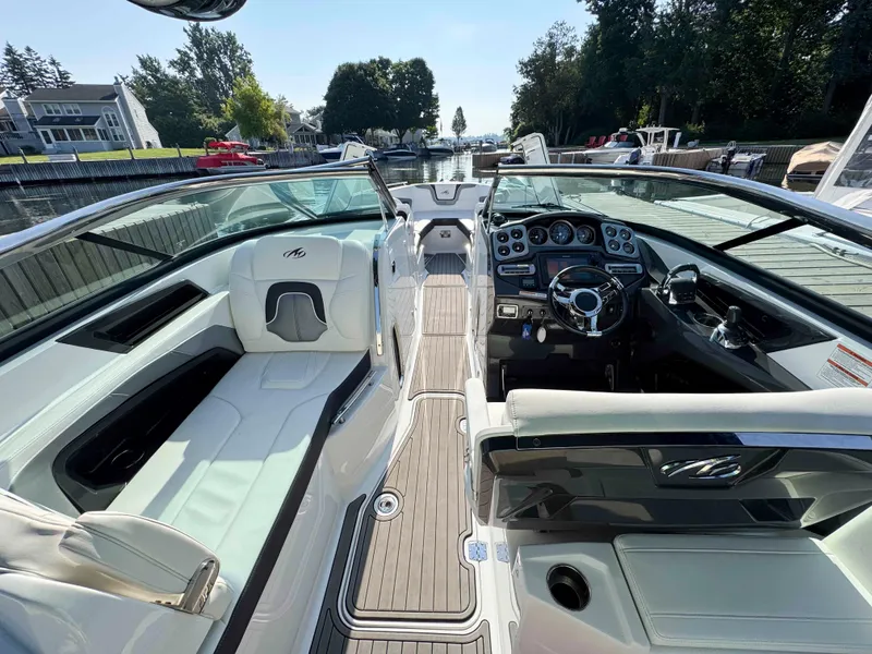 Slide: The Image of 2017 Monterey 328 Super Sport boat interior with sleek dashboard and luxurious seating. - 5