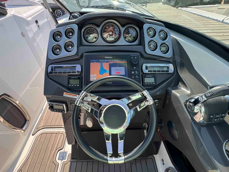 Slide: The Image of Steering console of a 2017 Monterey 328 Super Sport boat with navigation display. - 8