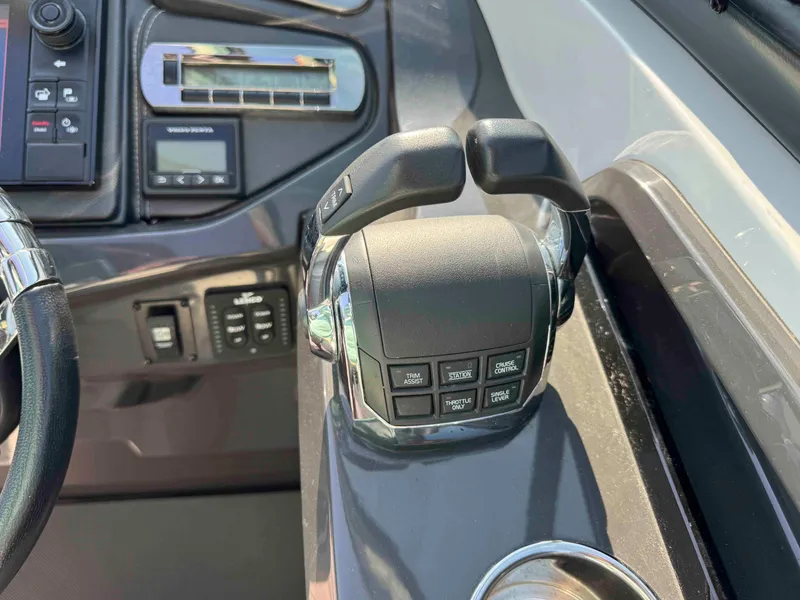 Slide: The Image of Control panel of a 2017 Monterey 328 Super Sport boat, featuring throttle and buttons. - 9