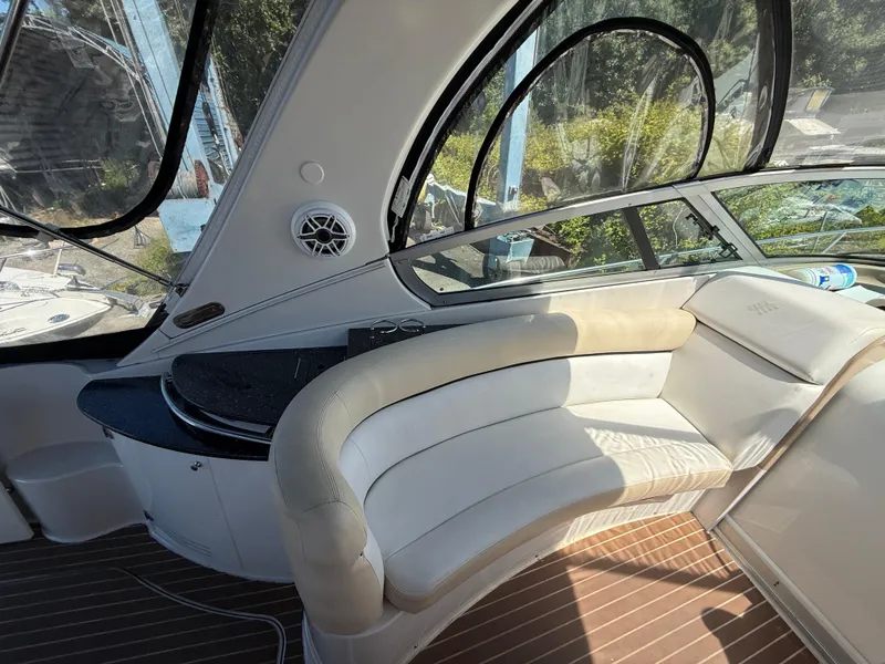 Slide: The Image of 2008 Four Winns V358 boat interior with curved seating and sleek design. - 10
